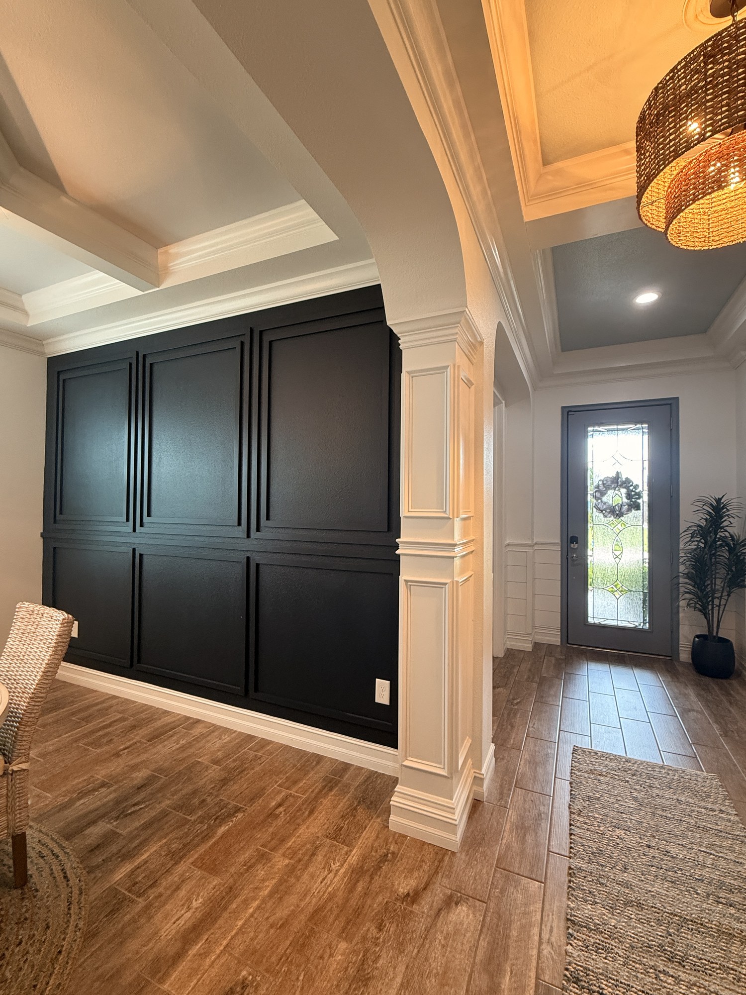 Black picture-frame moulding accent wall in a foyer, Lakewood Ranch, FL