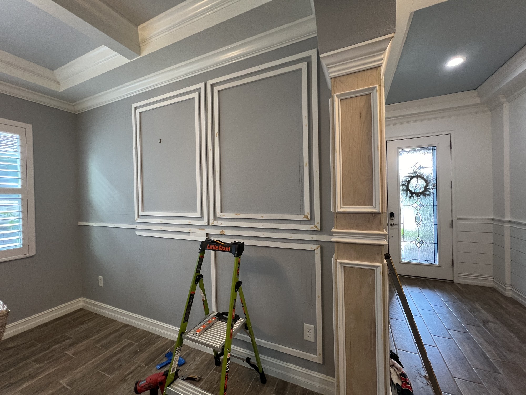 Custom trim and millwork installation in progress inside a Florida home