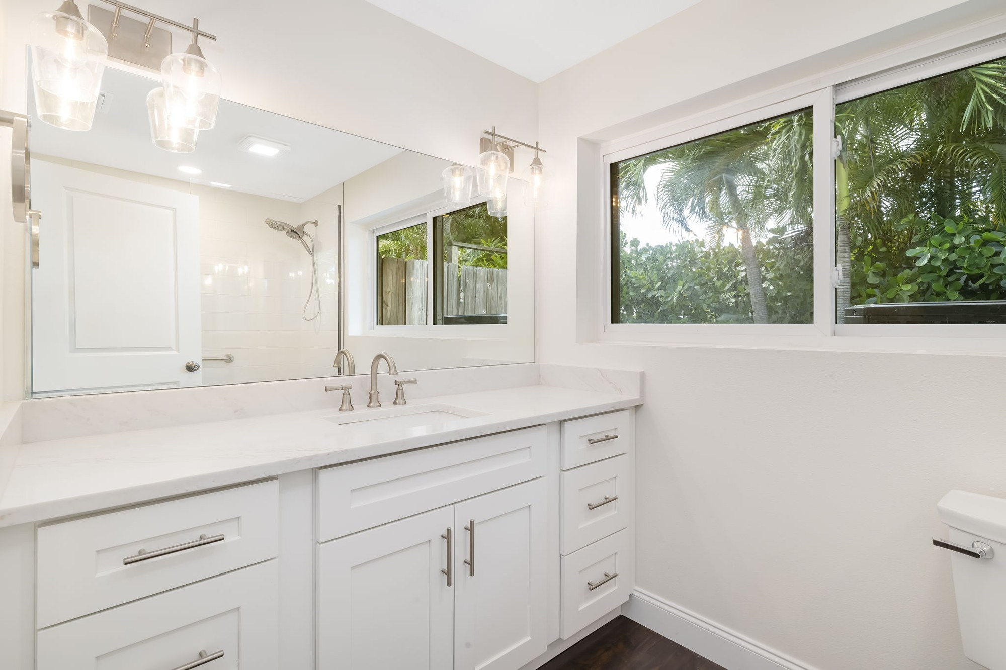 Finished ADU bathroom with quartz vanity and walk-in shower