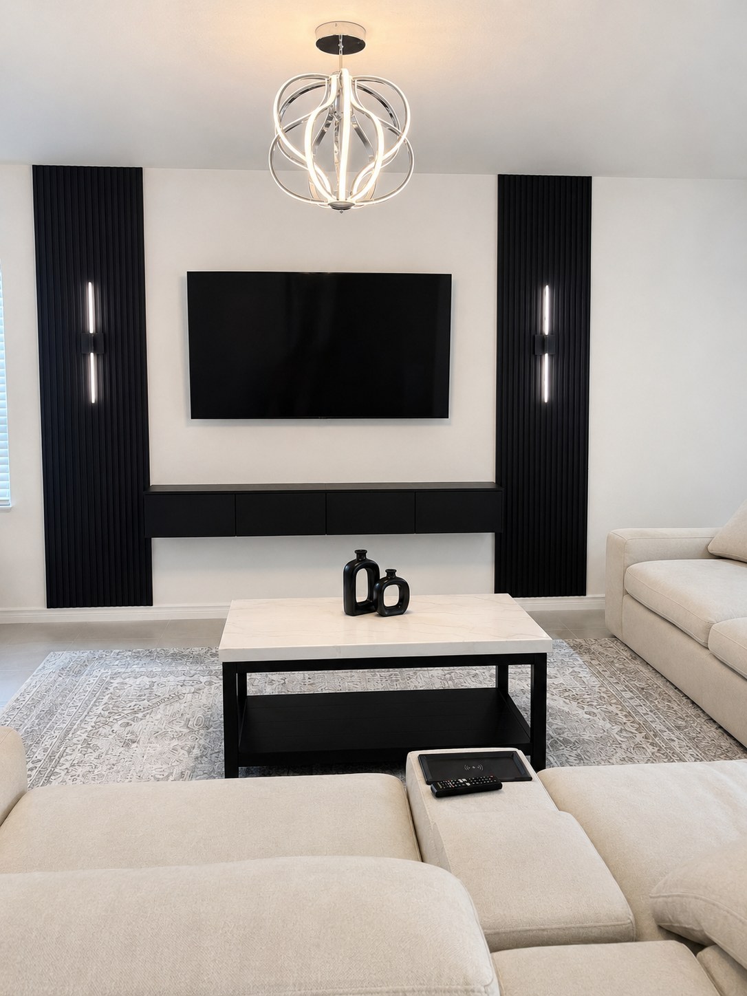Custom slatted wood TV wall with floating media console