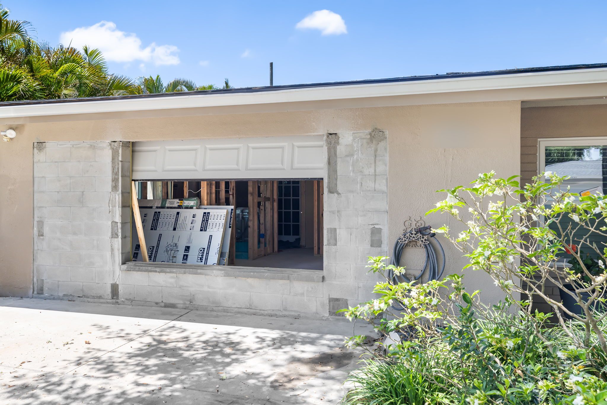 Exterior view of a garage conversion in progress
