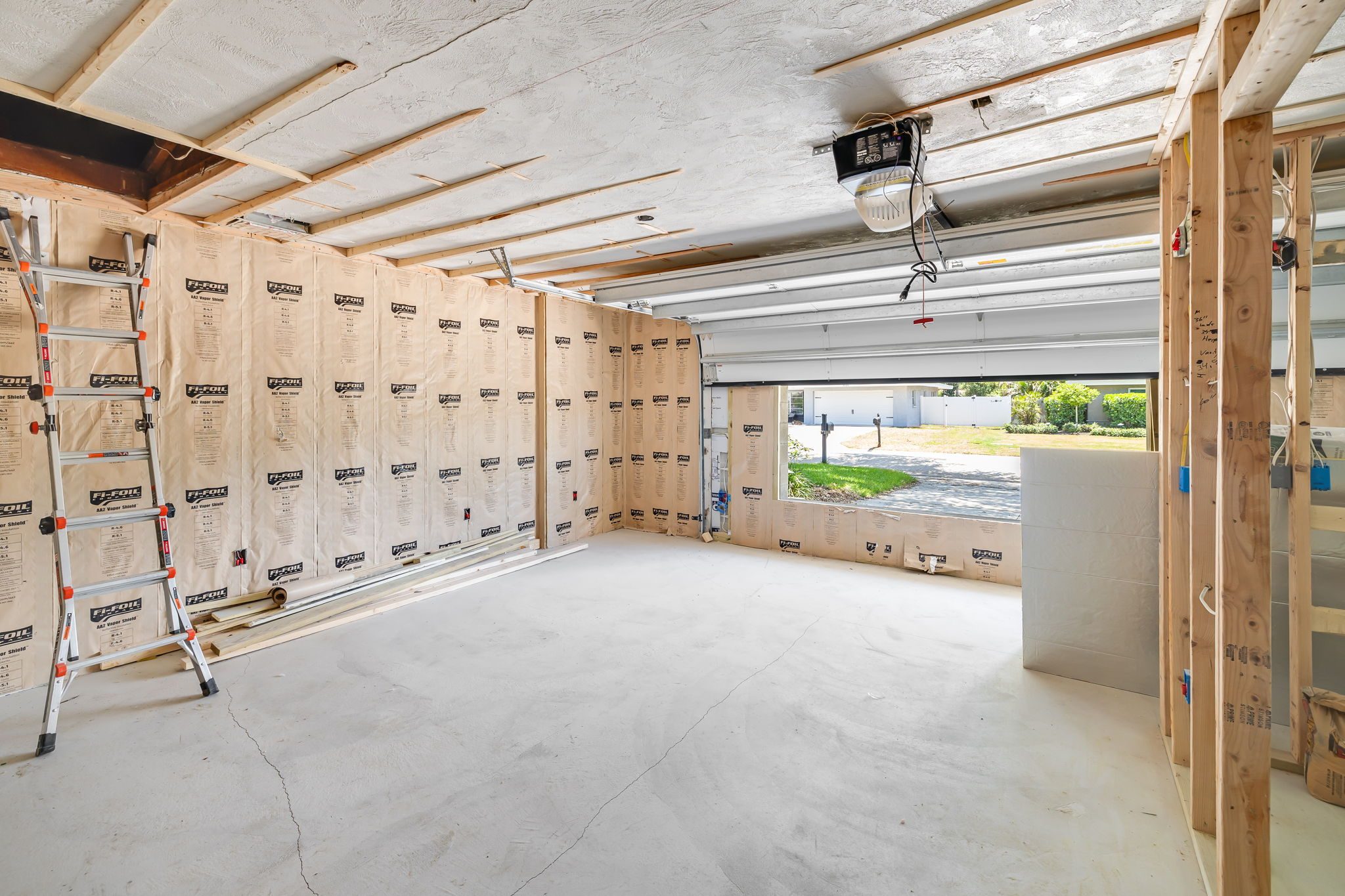 Garage conversion in progress, framing and insulation underway