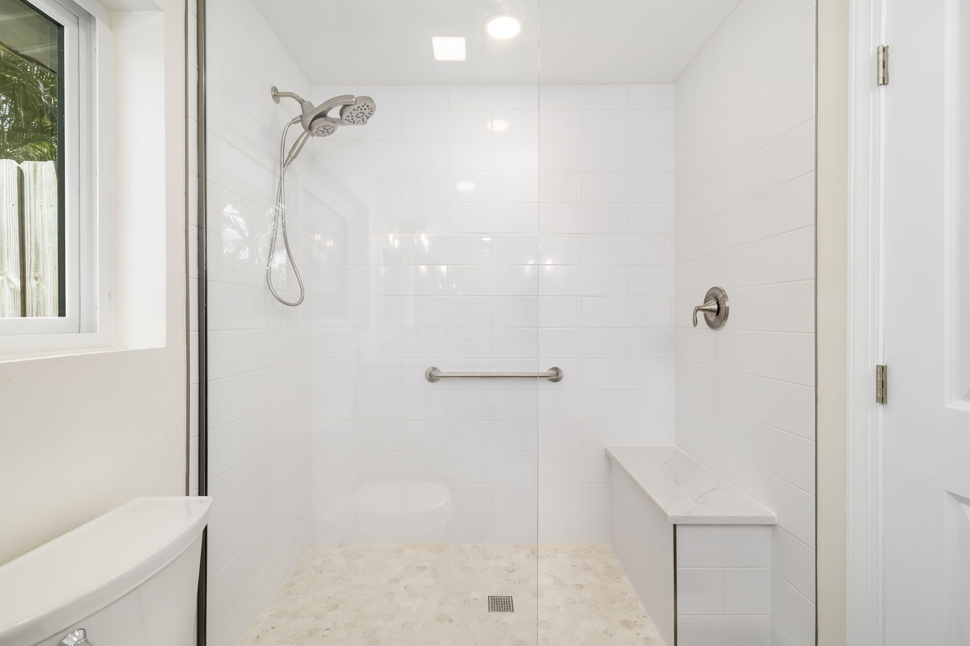 Finished garage conversion walk-in shower with tile surround