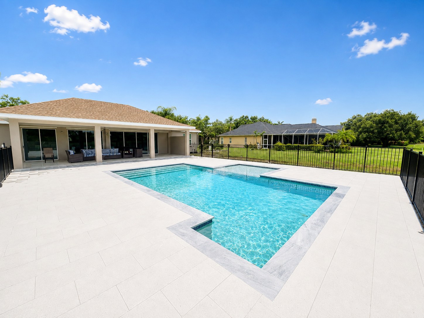 Finished pool with paver deck and covered lanai