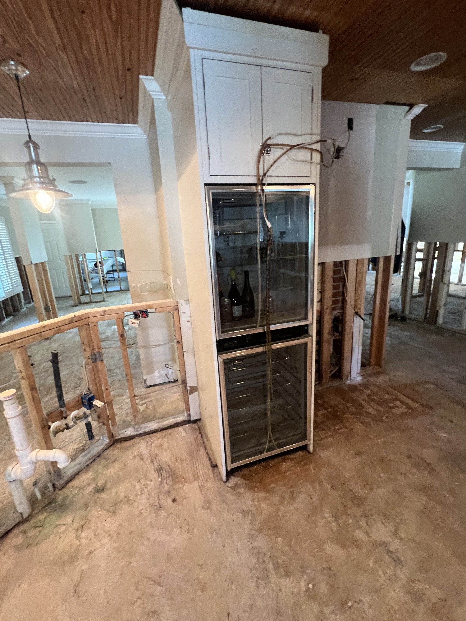 Flood-cut drywall removed to a clean line to stop mold from spreading further