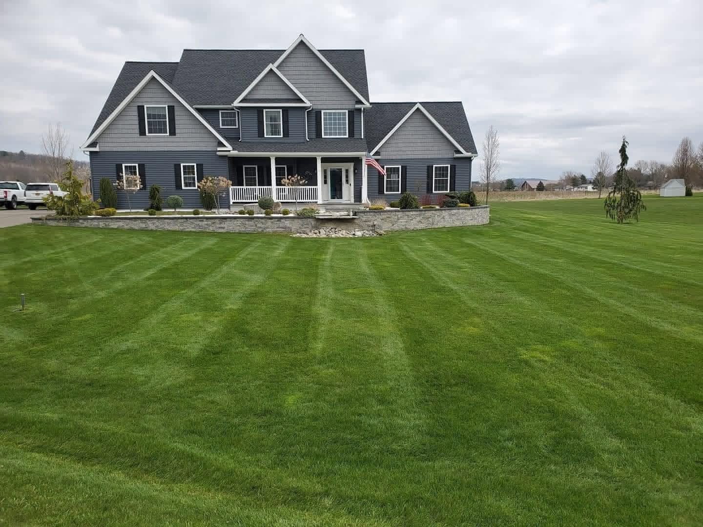 A finished home and landscaped lawn from DJ's original outdoor living company in Western New York