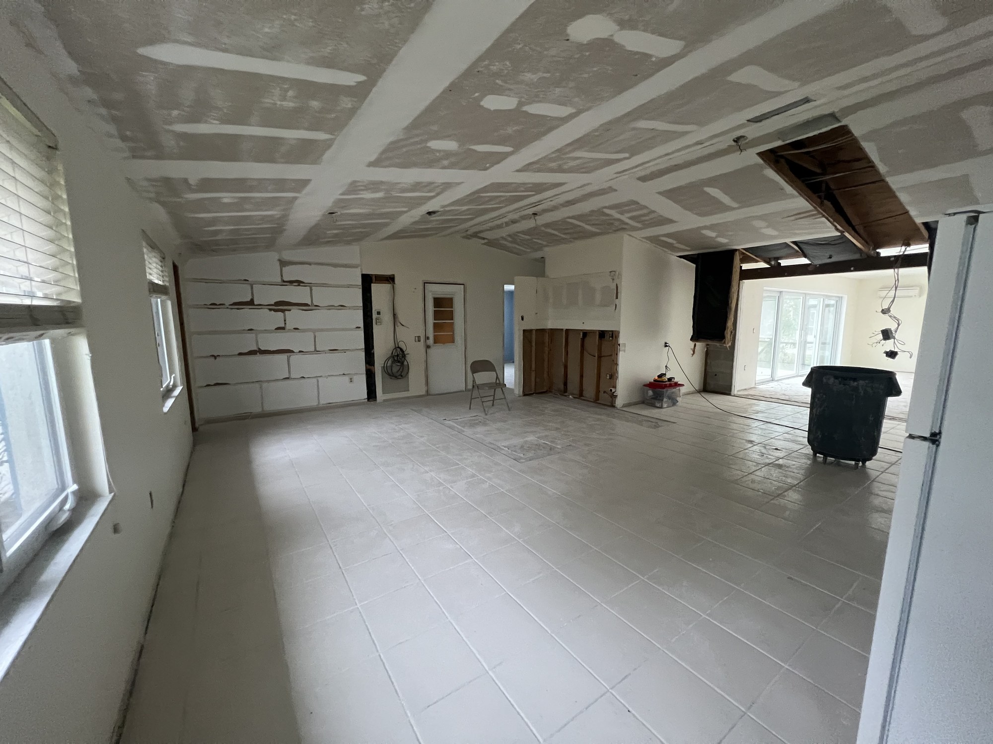 Ceiling and wall framing exposed during a whole-home remodel